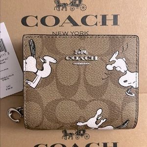 Coach X Peanuts Snap Wallet In Signature Canvas With Snoopy Print